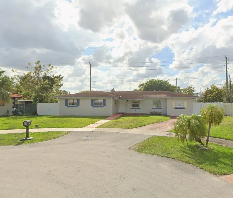 Exterior of Nesly Home Care, a single-story house with a front lawn